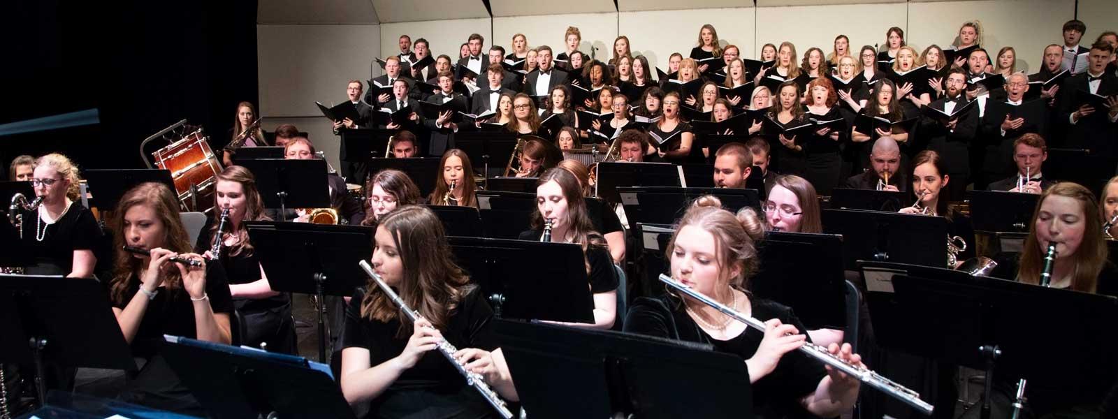 Choral and instrumental ensembles perform together