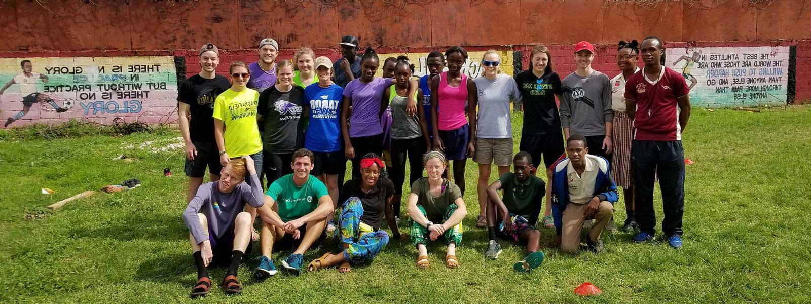 SBU students pose for photo with group of kids in Dominican Republic
